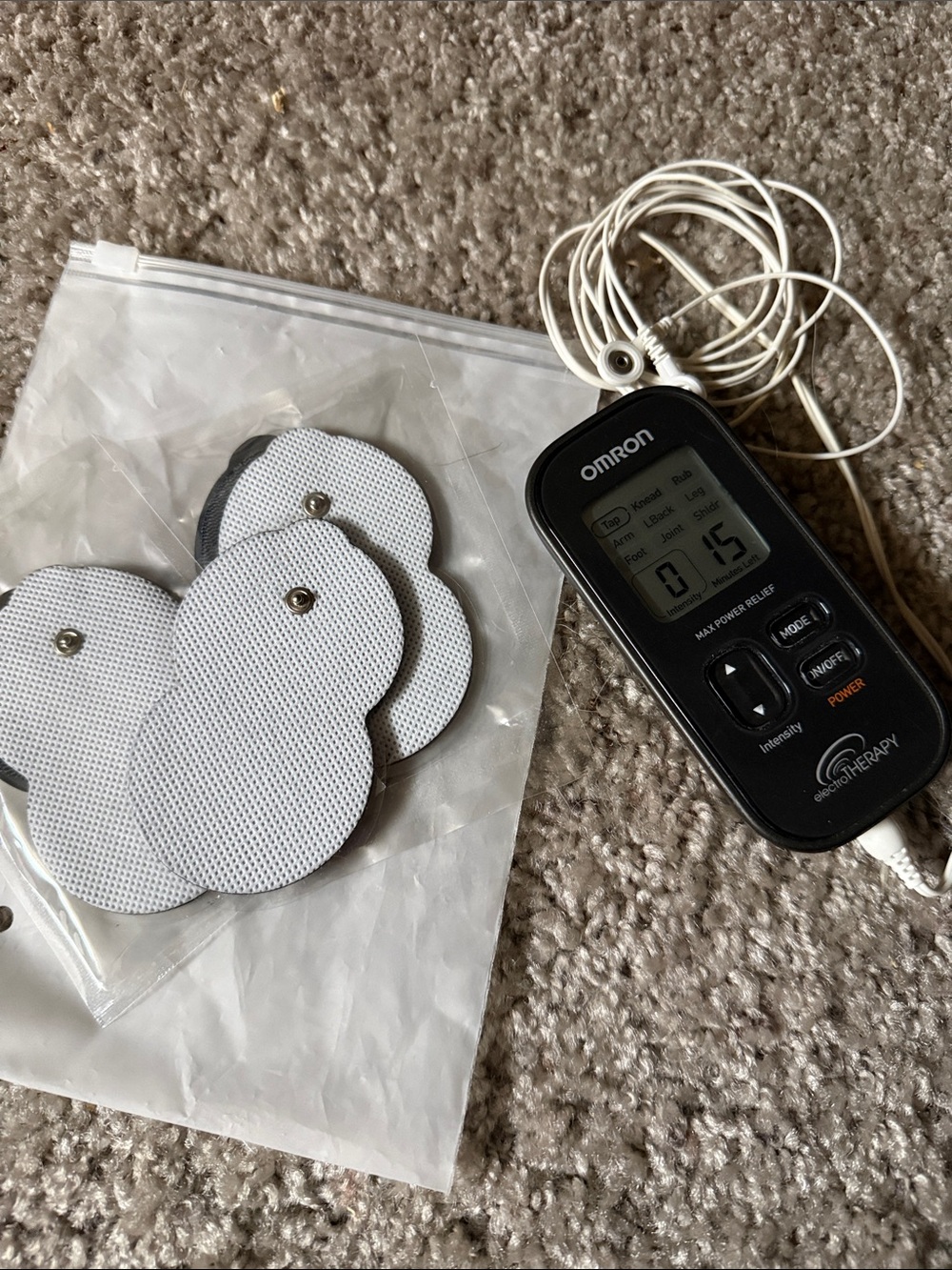 OMRON Black and White Portable Electrotherapy Unit with Round Electrode Pads